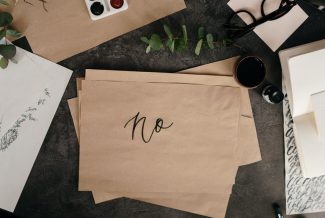 The word "No" written on brown paper