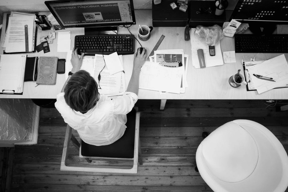 Black and white phot of office worker at desk
