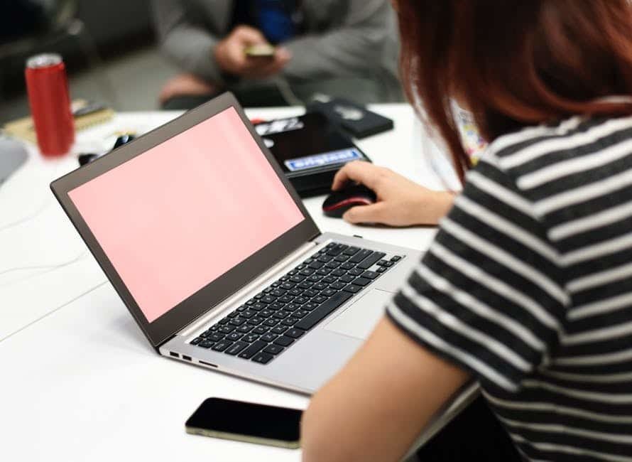 Woman working on laptop at table