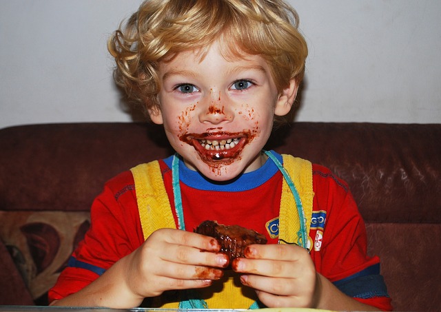 Smiling boy eating cake
