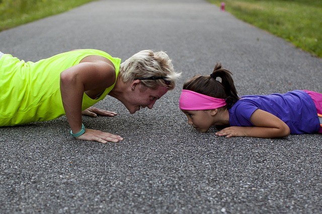 Woman and child doing push ups