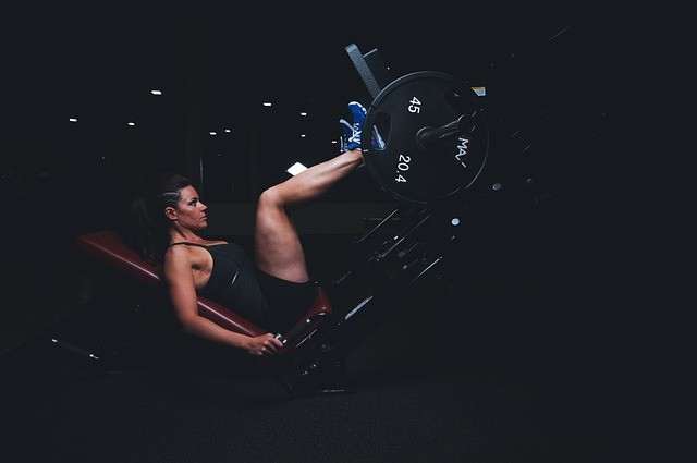 Woman lifting weights with her legs