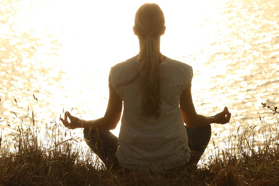 Woman Meditating in Yoga Pose