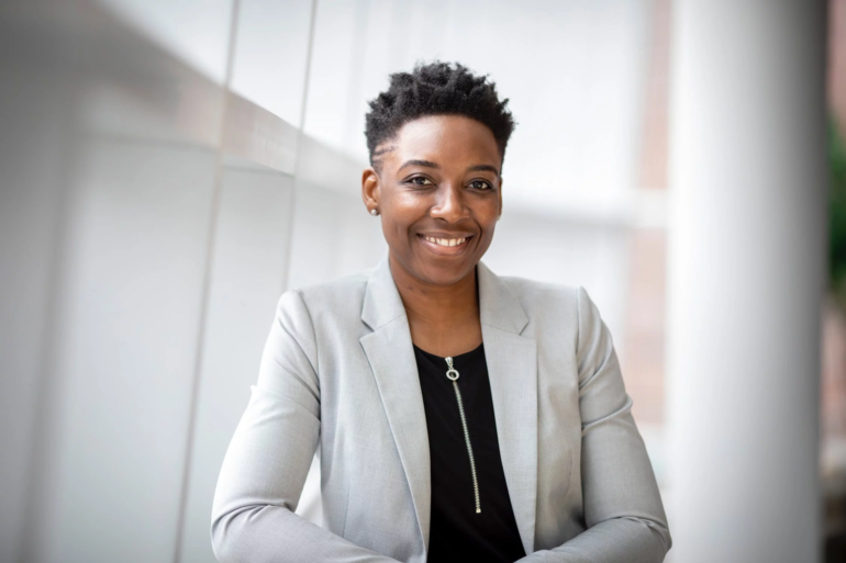 Smiling Business Woman in White Suit Jacket