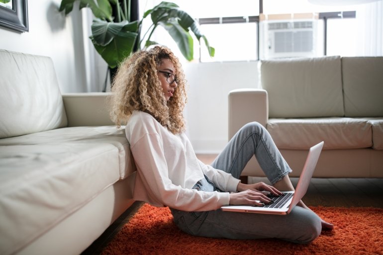 Woman sat on floor working