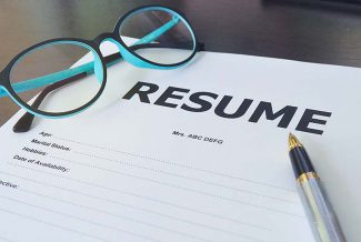 Resume Print Out with pen and glasses
