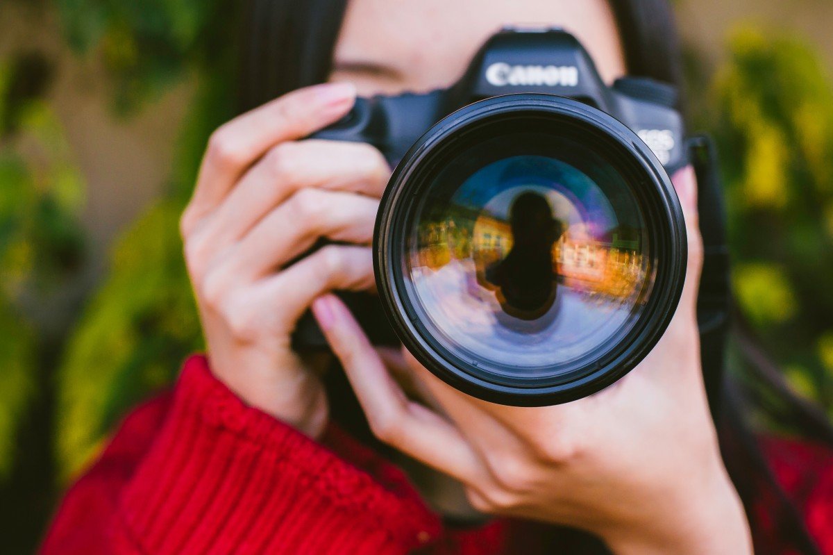Person holding a camera