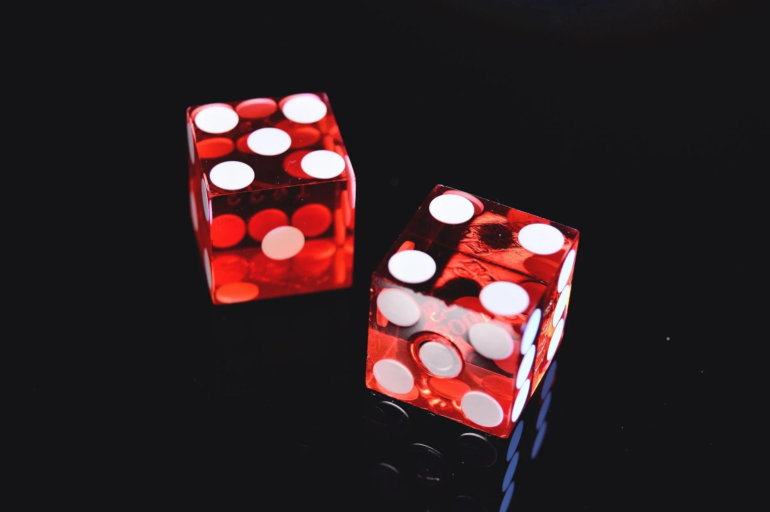Pair of red dice on a black background