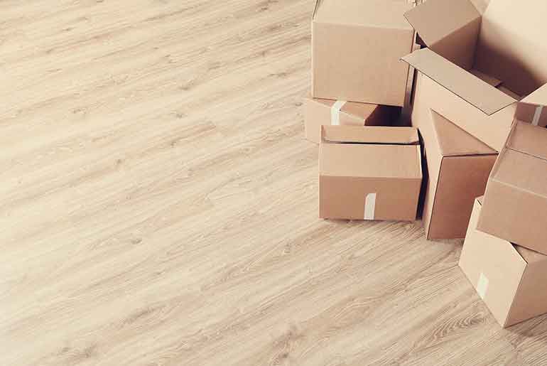 Moving boxes on a wooden floor