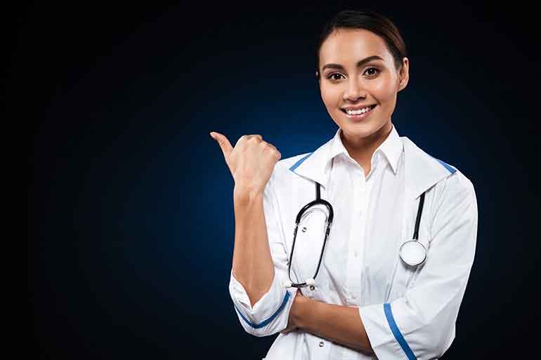 Female nurse pointing to one side