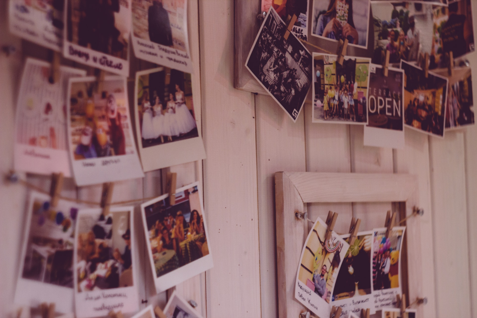 A wall with customized photos hanging on it