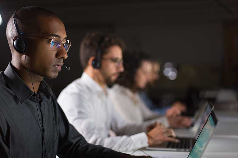 Help desk operators concentrating on their screens