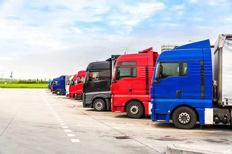 Fleet of lorries parked up in a row