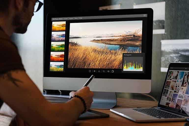 Man editing a photo on an iMac