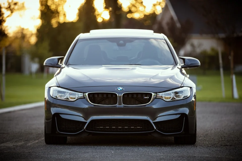 BMW saloon car at sunset