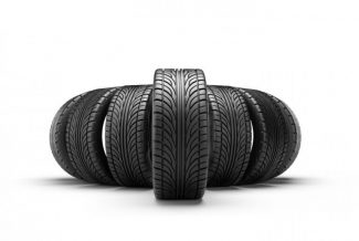 Group of black tires on a white background