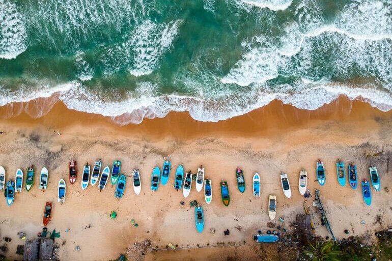 Boats pulled ashore on a beach in Sri Lanka