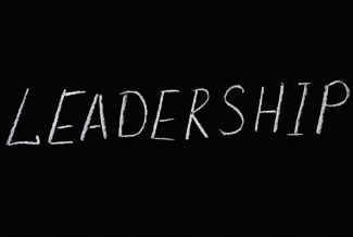 Leadership text on a black background