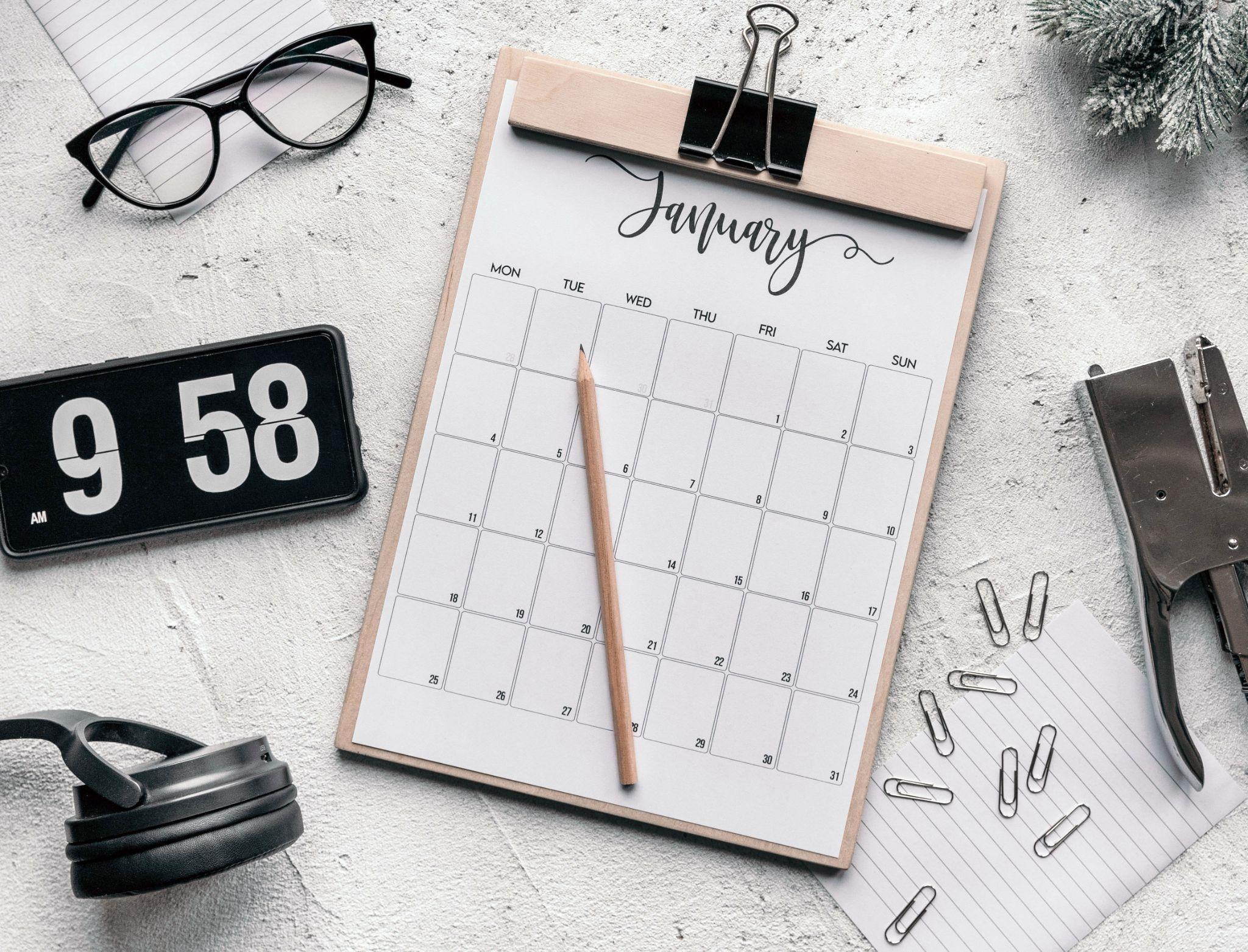 January Calendar printable on a clipboard