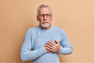 Man clutching his chest in pain