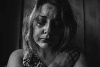 Black and White photo of a woman crying