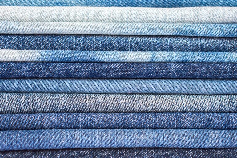 Different shades of denim stacked on top of each other