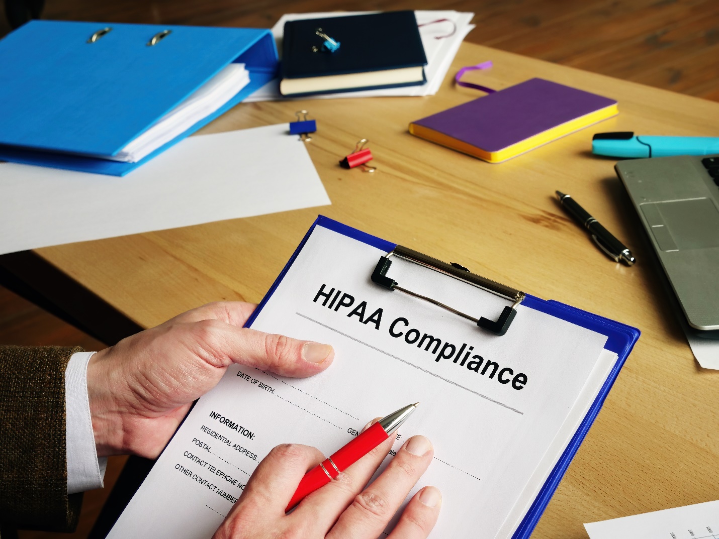 HIPPA Compliance form on a clipboard