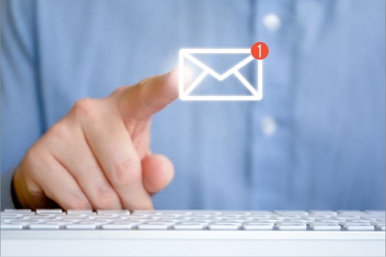Person pointing at an email envelope icon