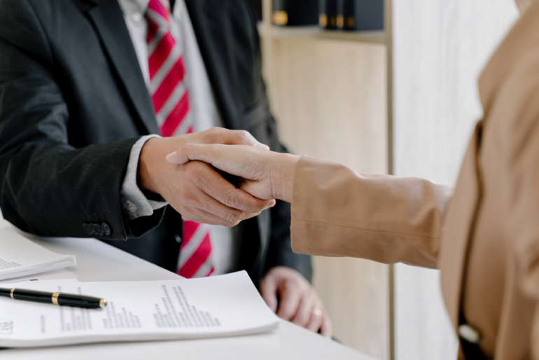 Lawyer Shaking Hands With A Client