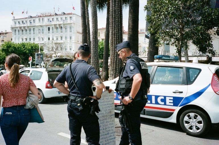 Two police officers at the scene of an incident