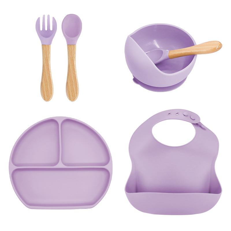 Purple baby feeding set, utensils with wooden handles and a bib