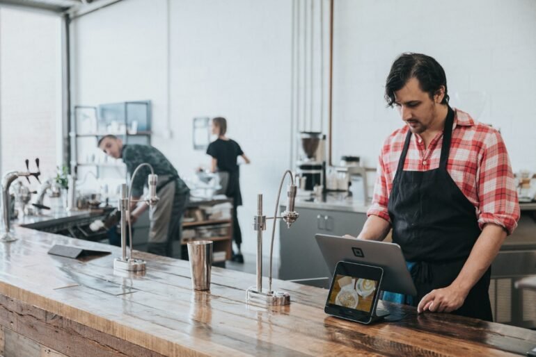 Barista using a tablet EPOS system