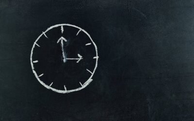 A chalk clock on a blackboard